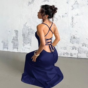 Detail of the elegant open-back navy blue satin dress with cross lace-up design