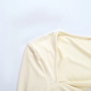 Detail of neckline stitching and soft knitted fabric texture on slim fit t-shirt