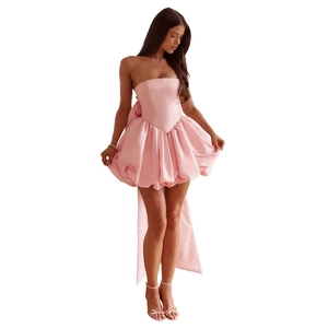 Detailed back view of pink satin tube dress featuring a large decorative bow and long sashes