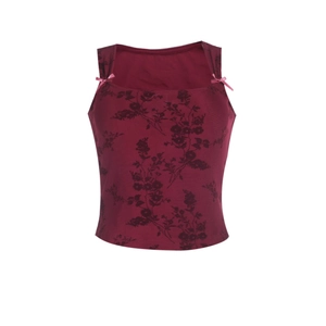 Detail of burgundy floral camisole top featuring pink shoulder bows and square neckline
