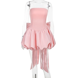 Detailed back view of pink strapless mini dress featuring a large satin bow and ribbons