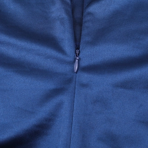 Macro shot of seamless invisible zipper detail on navy blue slim fit floral top