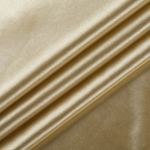 Detailed macro view of champagne gold satin fabric texture with elegant metallic luster