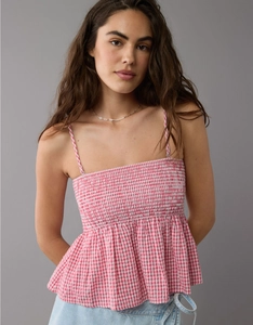 Detail of pink plaid tube top featuring smocked chest design and adjustable thin straps