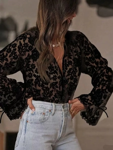 Elegant black lace long sleeve top with floral flocking and V-neck for stylish women