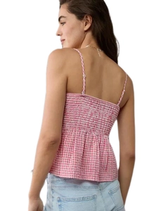 Detail of pink gingham camisole showing adjustable straps and elastic smocked back design