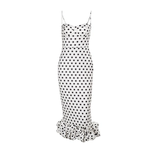 Detail of white polka dot dress with sweetheart neckline and ruffled fishtail hemline