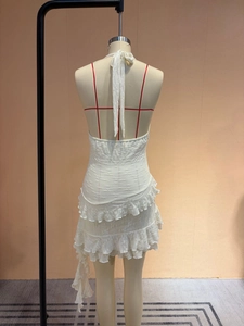 Elegant white halter neck backless mini dress with layered ruffle hem and floral texture
