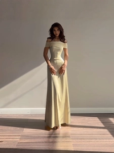 Elegant champagne off-the-shoulder satin ball gown with high-waist A-line silhouette