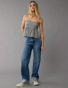 Detail of vintage black and white gingham tube top with adjustable straps and denim jeans