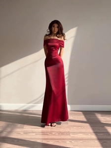 Elegant burgundy off-shoulder satin gown with pleated bodice and floor-length skirt