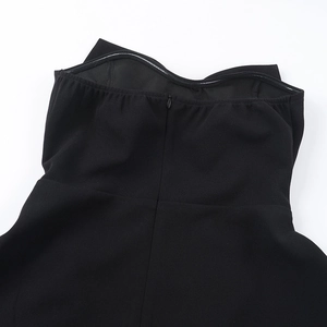 Detail of black strapless dress featuring an invisible zipper and anti-slip silicone strip