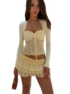 Slim fit long sleeve ruched top with tiered mini skirt set in cream color