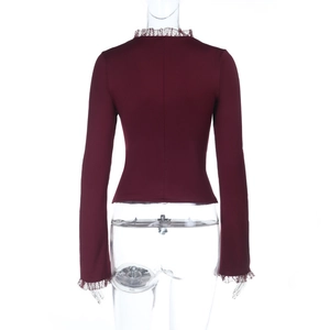 Detailed back view of burgundy long sleeve top with delicate lace trim on high neck