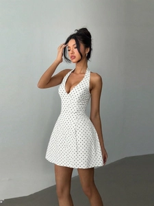 Sexy white polka dot halter neck dress with deep V-neck and slimming high waist A-line fit