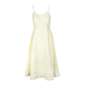 Detailed macro shot of light yellow jacquard fabric texture on an A-line princess dress