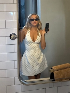 Sexy halter neck white polka dot mini dress with a deep V-neck and open back for summer