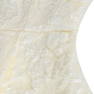 Detailed macro shot of premium cream floral jacquard fabric and clean stitched seam