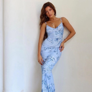 Slim fit light blue floral print midi dress with thin straps and a soft V-neckline