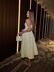 Elegant cream off-shoulder midi dress with floral texture and spaghetti straps
