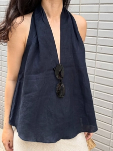 Close-up of navy blue halter top in breathable cotton linen with elegant V-neck detail