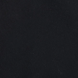 Macro shot of high-quality black textile fabric showing dense knit texture and fiber detail