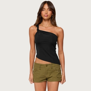 Detail of black one-shoulder top with knot and olive cargo shorts featuring eyelet accents