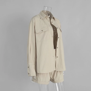 Detail view of cotton shirt and shorts set showing workwear pockets and cuffed hem