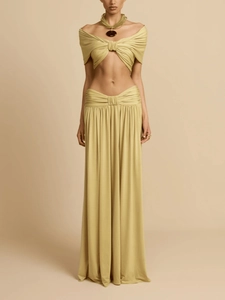 Women's chic mustard two-piece set featuring off-shoulder crop top and draped maxi skirt