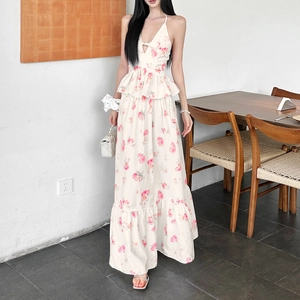 Detail of floral halter top with bow and matching flowy long skirt in cream pink