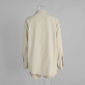 Back view of a casual beige cotton long-sleeved shirt and loose shorts matching set
