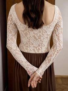 Elegant white lace long sleeve top with deep U-back design and floral crochet texture