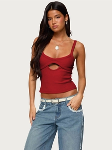 Detail of red ribbed crop top featuring front oval cutout and slim-fit corset style