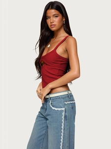Detail of a dark red ribbed tank top featuring a crescent-shaped chest cutout design