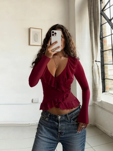 Retro wine red long sleeve top with ruffles and deep V-neck shown in mirror selfie