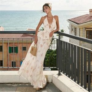 Detailed view of floral chiffon two-piece set with halter top and maxi skirt for vacation