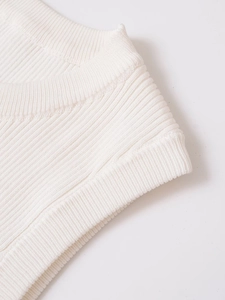 Close-up of white ribbed knit fabric texture on a French style corset top for women