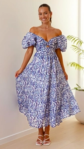 Detail of the blue floral puff sleeve dress with a cutout bust and tiered A-line skirt