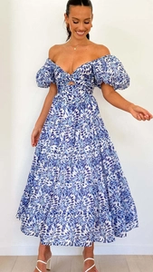 Detail of blue and white floral dress showing tube top, cutout waist and tiered skirt