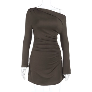 Detail of ruched olive mini dress showing long sleeve and asymmetric neck