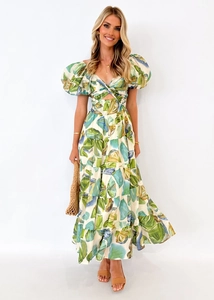 Detail of artistic leaf print and waist hollow-out design on an A-line mini dress