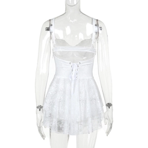Detailed back view of a white lace mini dress with open back and criss-cross ribbon tie