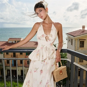 Detailed view of floral halter dress with bow-knot bust and ruffled waist detail