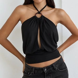 Detail view of black halter neck top with ring decoration and front cutout design