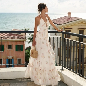 Deep V-neck floral halter dress with backless design and a cute front bow decoration