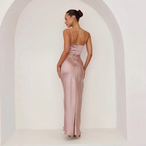 Detail of dusty pink satin backless maxi dress with delicate straps and glossy finish