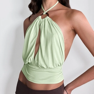 Detail of light green halter neck top with chest ring ornament and cutout design