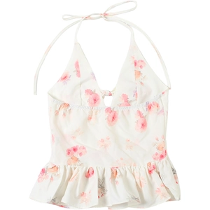 Flat lay of a white floral halter top featuring pink patterns and a ruffled peplum hemline