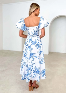Detail of white dress back showing elastic shirring and blue floral patterns