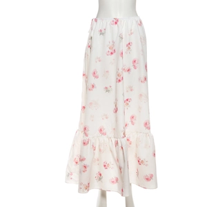 Detail of white floral chiffon skirt with elastic waist and ruffled hemline